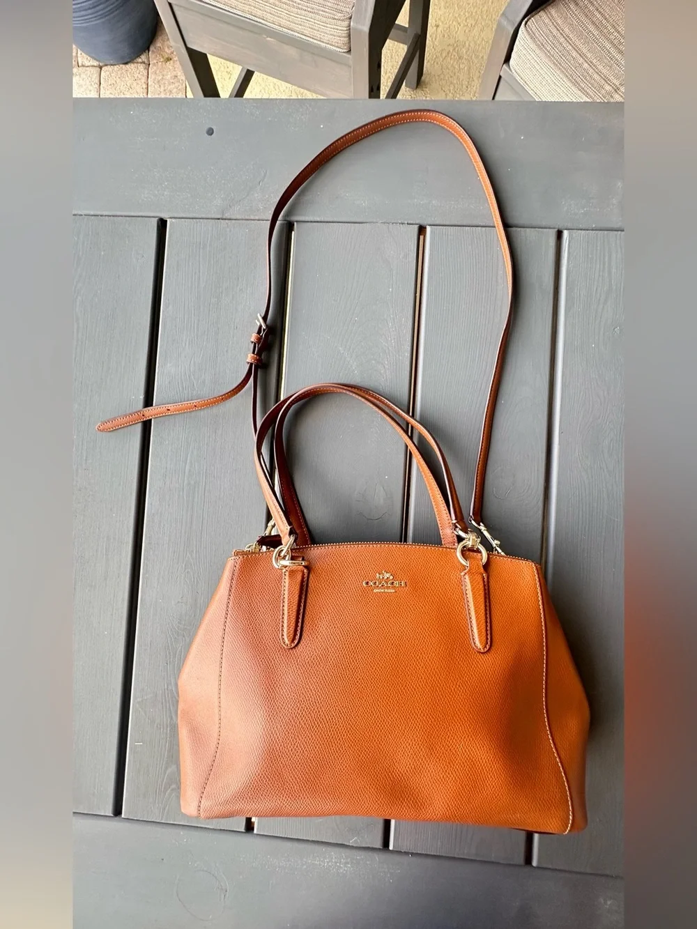Coach Christie Carryall in a brown, textured leather with gold-tone hardware
